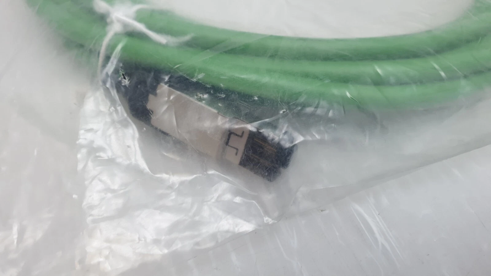 RJ45 plug end of the B&R X67CA0E41.0050 green PUR cable inside the bag