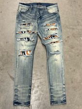 AMIRI Skinny Slim Fit Jeans Blue Denim Light Wash Distressed Patterned Patch