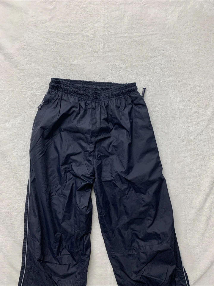 Pantalones cortavientos atléticos vintage marca Elite para hombre XS bolsillos cremallera tobillos pista Foto 2 de 4