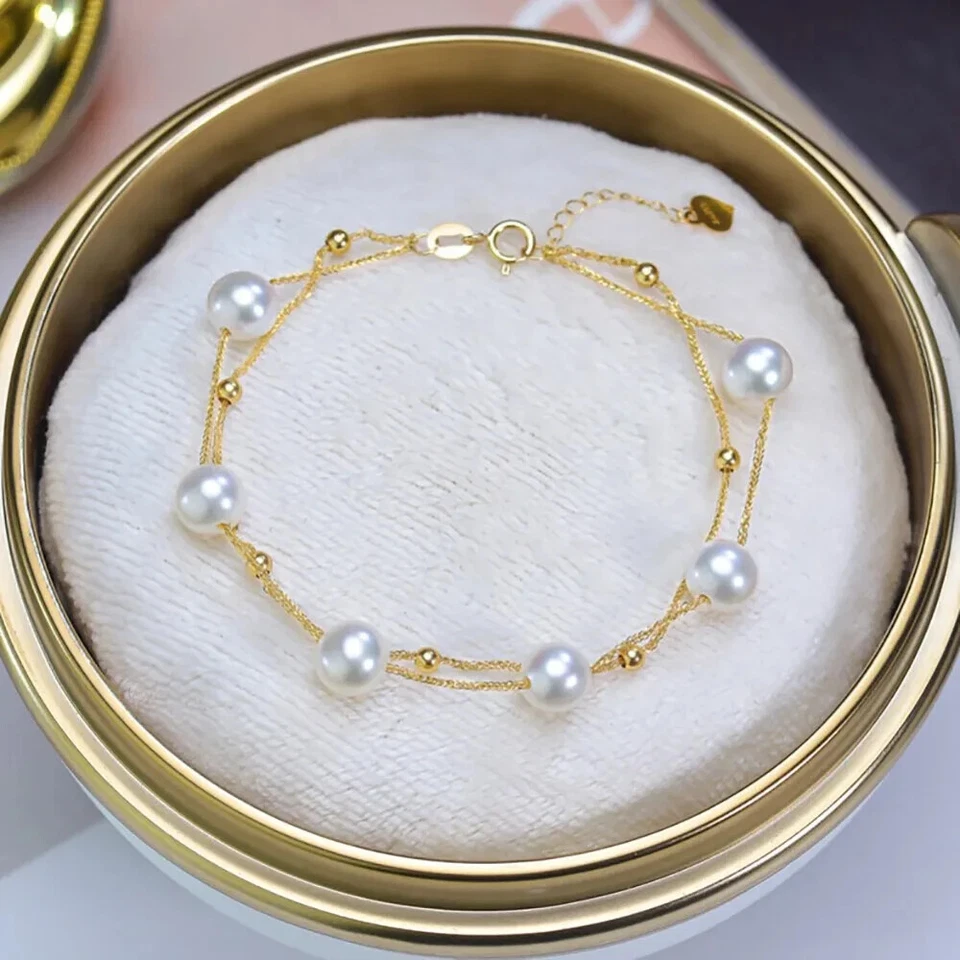 Pulsera de doble capa de perlas de agua dulce naturales de oro de 18 quilates con dije de corazón de cuentas Foto 4 de 4