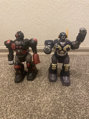 Two Hap-P-Kid Toy Robot Fighter Blue/ Gray. Red/black WALKS 7'' Battery Operated