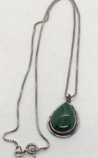 A sterling silver Malachite pendant with a box link chain. excellent condition