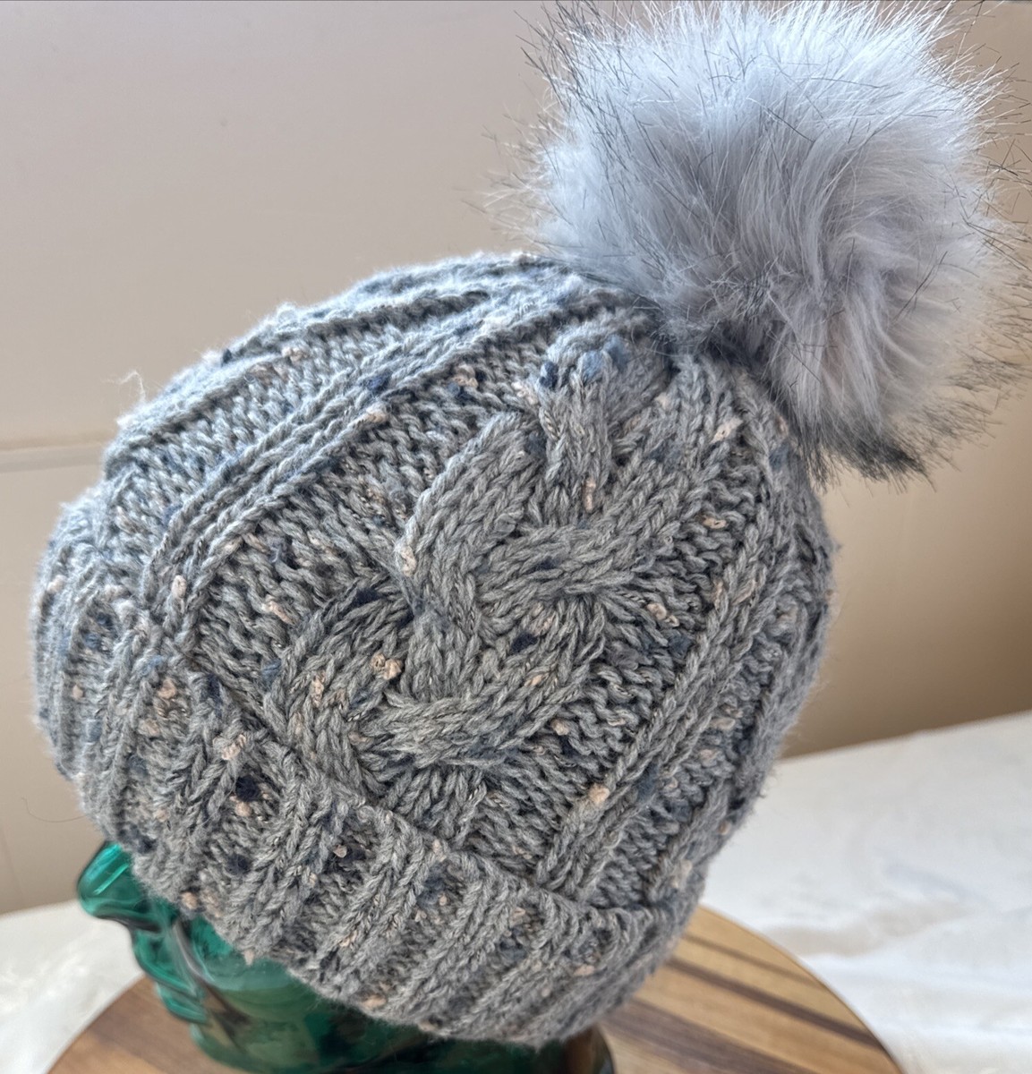 NWOT BEAUTIFUL CABLE KNIT WINTER HAT WITH FAUX FUR POM POM. NEVER