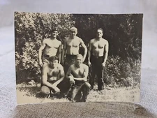 Shirtless  young Guys muscles press.