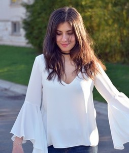 white shirt with flowy sleeves