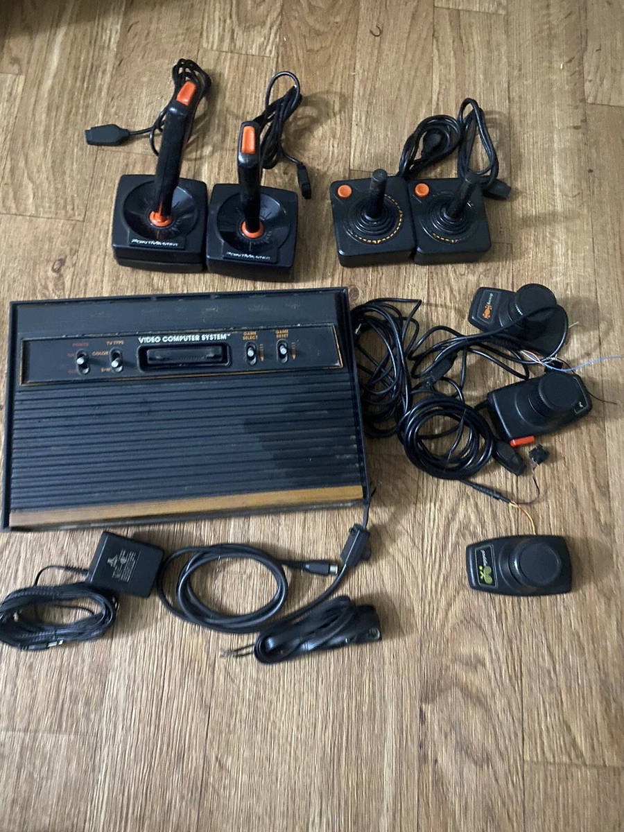 Atari CX 2600 Video Computer System 4 Controllers 3 Paddles Sold As Is Untested
