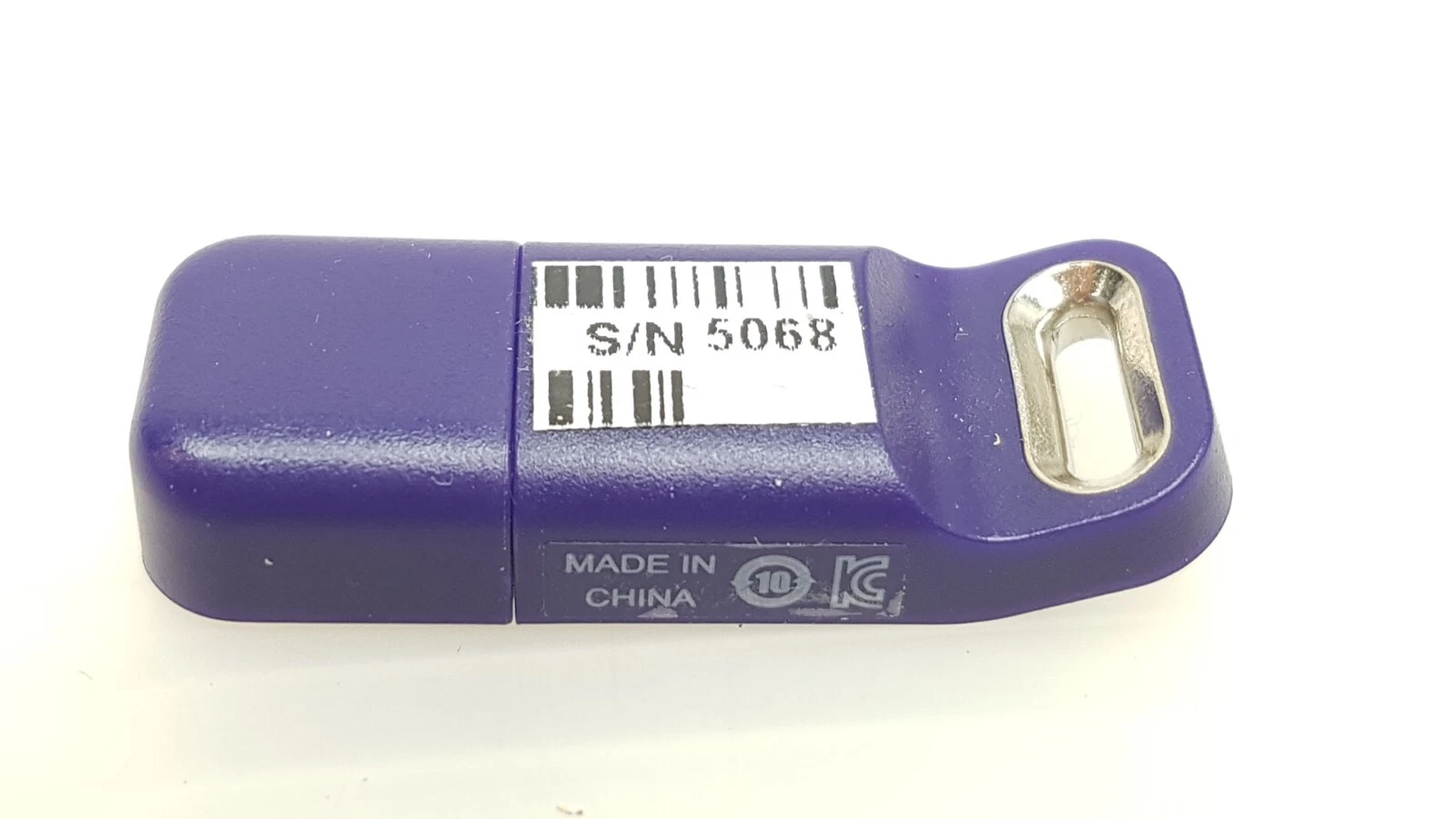 Reverse of the LightSheer Desire HS key with barcode label and KC mark