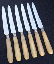 6 couteaux anciens apollonox inox métal argenté manches corne.