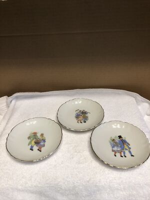 Group of three small round plates