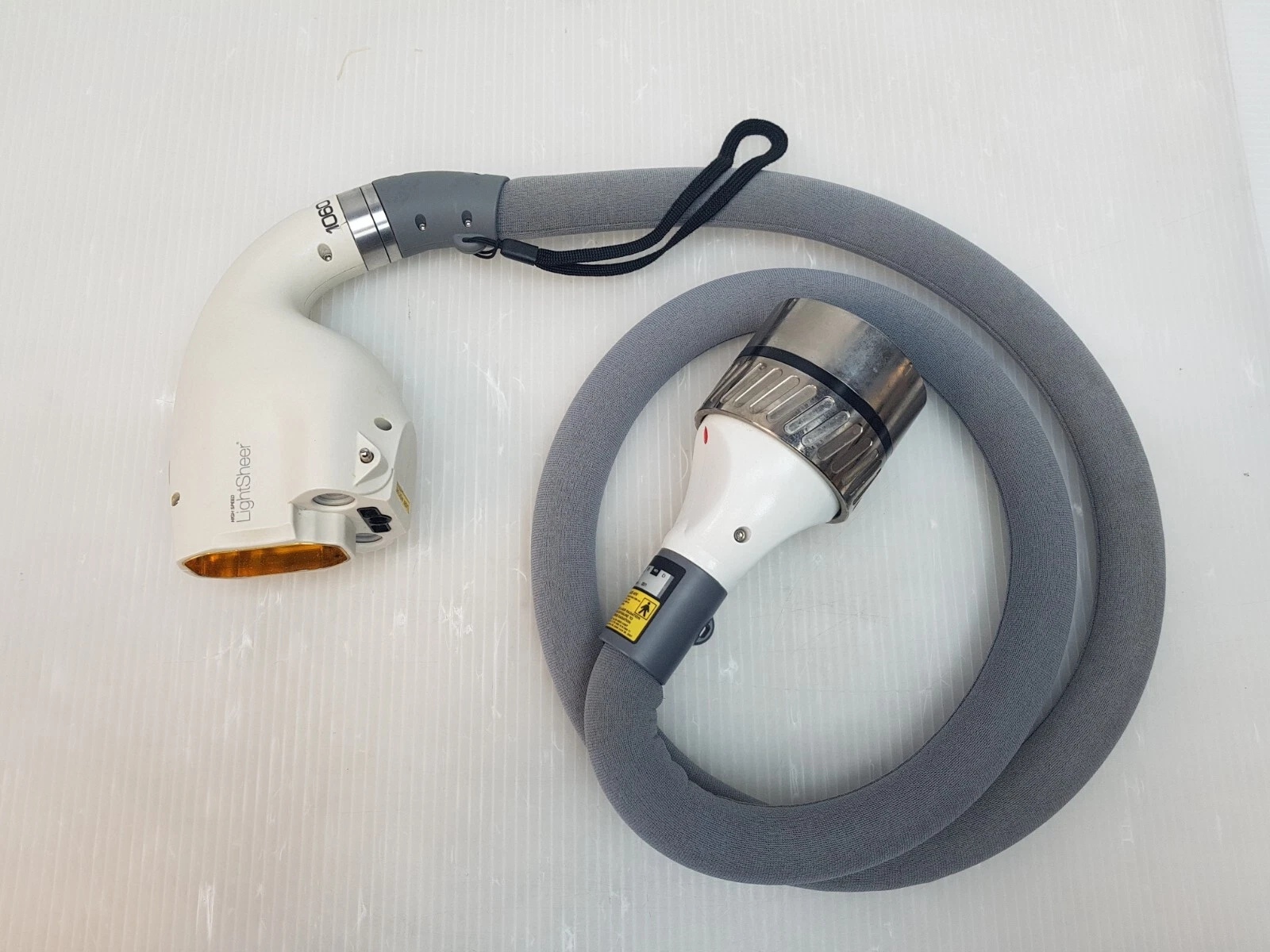 Lumenis High Speed LightSheer handpiece with grey foam-covered cable and metal connector