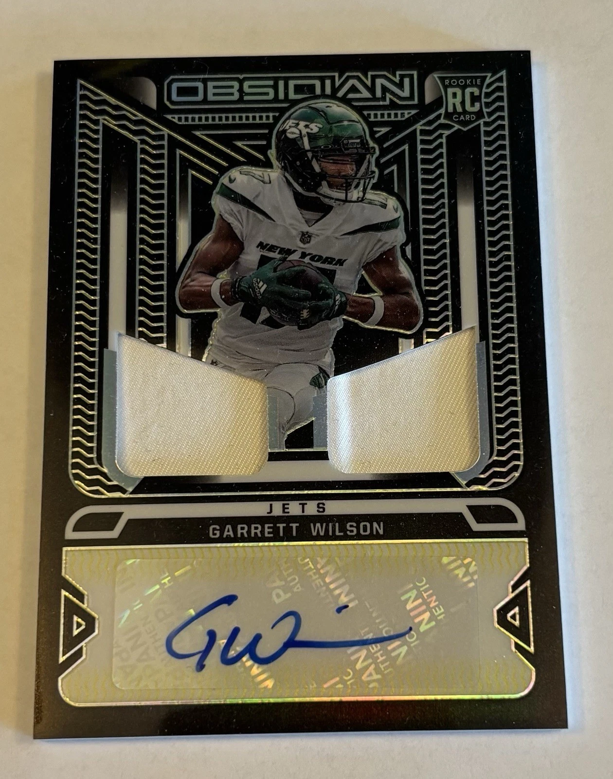 Garrett Wilson Panini Obsidian Rookie Jersey Ink #RJIGWI Electric Etch Yellow