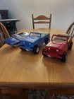 2 Tonka Jeepsters and 1 Tonka Boat.