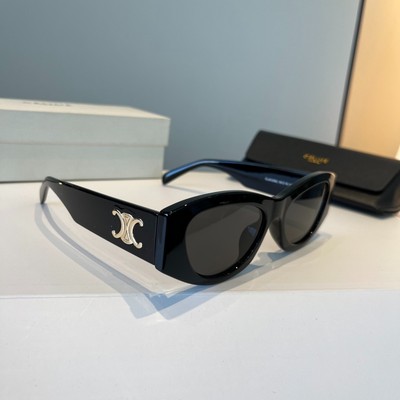 Celine sunglasses, black and gold is the logo.