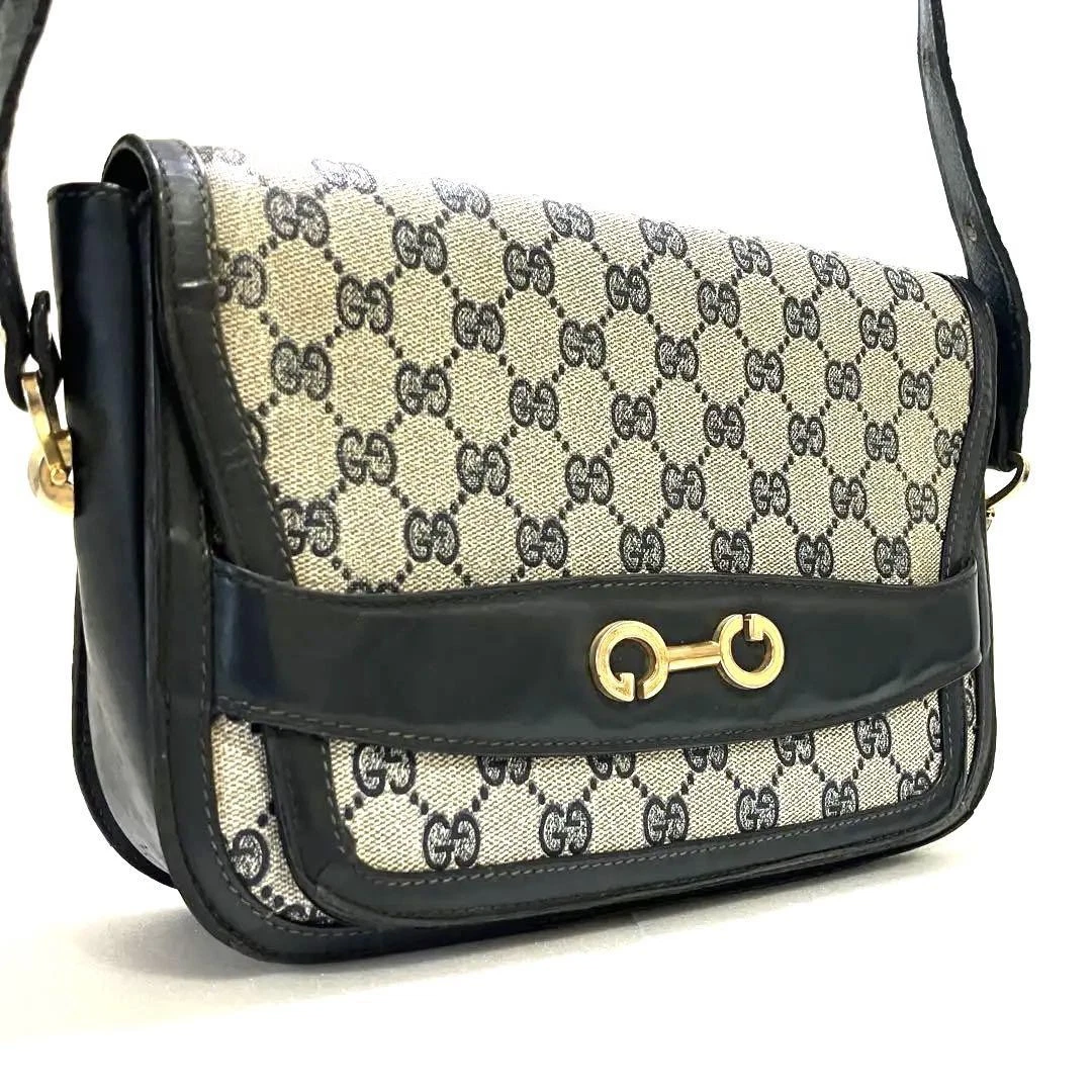 Sac à bandoulière GUCCI bleu marine motif Gg 2 voies