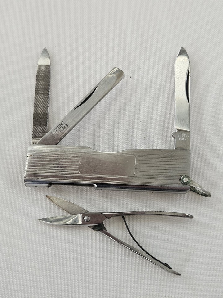 A tiny Italian-made multi-tool pocket knife from LATAMA with scissors, file, and blades — the kind of flea-market find that makes EDC collectors stop scrolling.