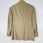 Ivory gold Austin Reed men's blazer with notch lapels, back zipper, and three-button closure, hanging on wooden hanger.