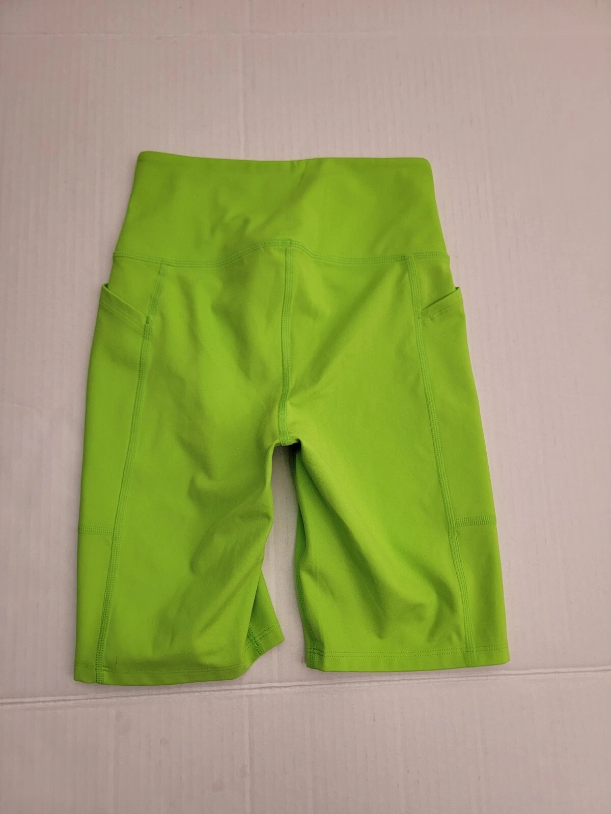 girlfriend-collective compression high rise side pockets shorts