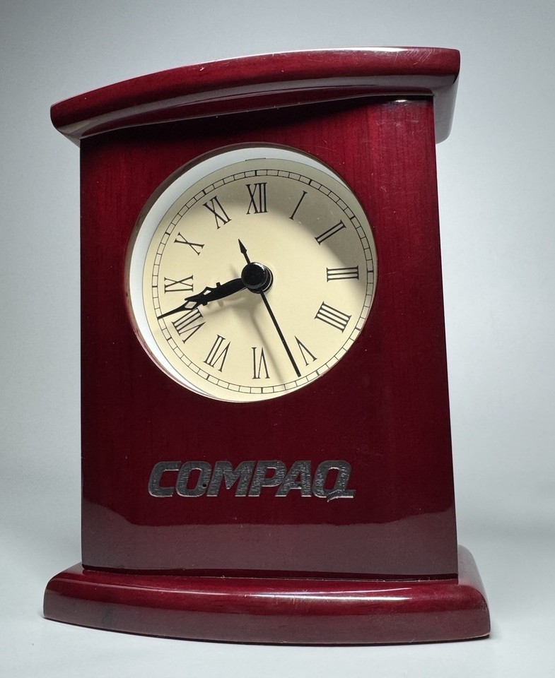A rare vintage Compaq executive promo desk clock in wood — peak late-80s/early-90s corporate tech swag that's now a delightfully ironic piece of computing history.
