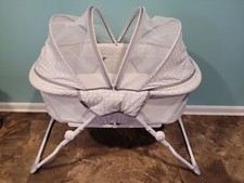 Delta Children EZ Fold Ultra Compact Travel Bassinet - Gray