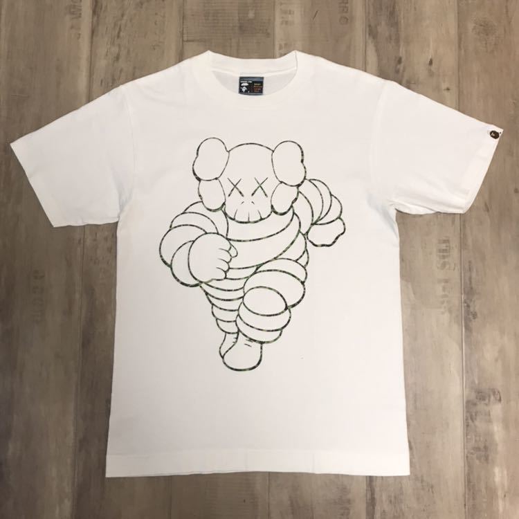 Kaws × BAPE Michelin Man chum T-shirt White A Bathing Ape Kaws × BAPE Michelin Man chum T-shirt White A Bathing Ape