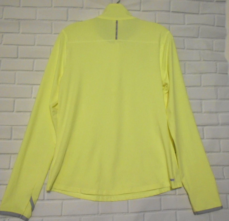 Camiseta deportiva de manga larga con reflector Henley amarillo mediano Danskin para mujer  Foto 4 de 4