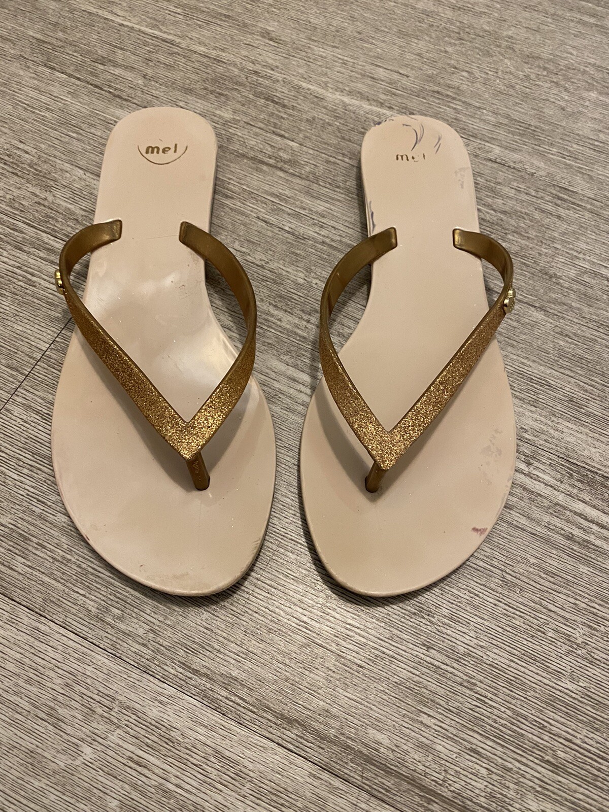 Mel gold colored flip flops with beige sole size 8M preowned shows sign of  wear | eBay