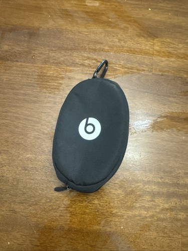 Empty black beats case with carabiner