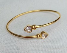 Avon Herz Armreif Cross Over funkelnd goldfar...