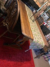 solid oak table with four wheel back chairs, very good condition no marks