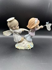 precious moments figurines  Held By The Hands Of Faith  