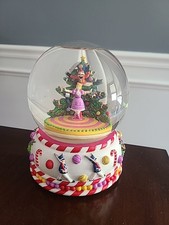 musical snow globe featuring characters and s...