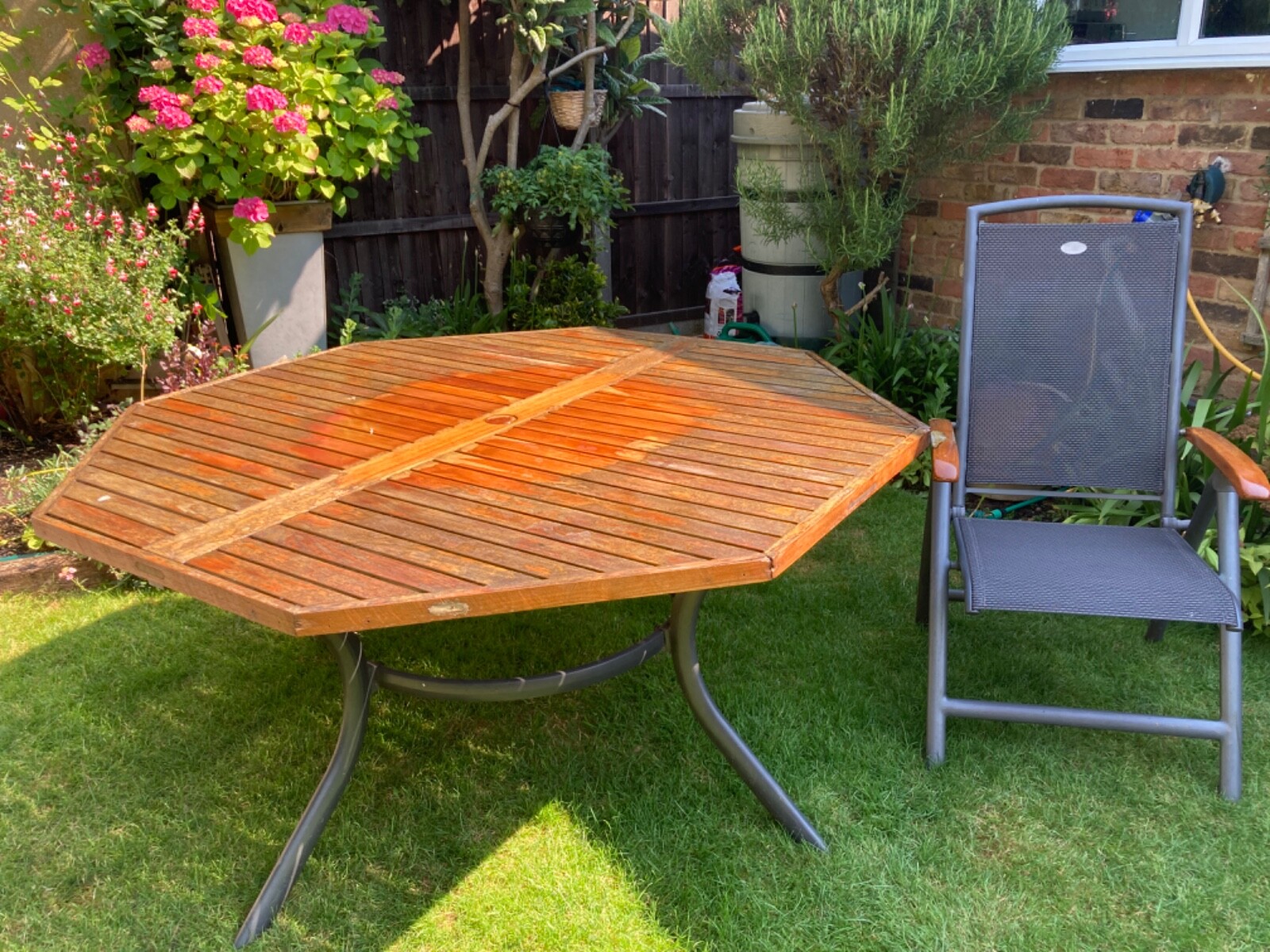 Wooden garden table and chairs, make is Hartman, chairs have wooden