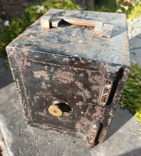 A VERY RARE SMALL STEEL HOME SAFE WITH KEY