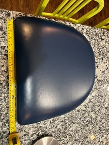 Lots of blue vinyl seat pads for metal restaurant dining chairs
