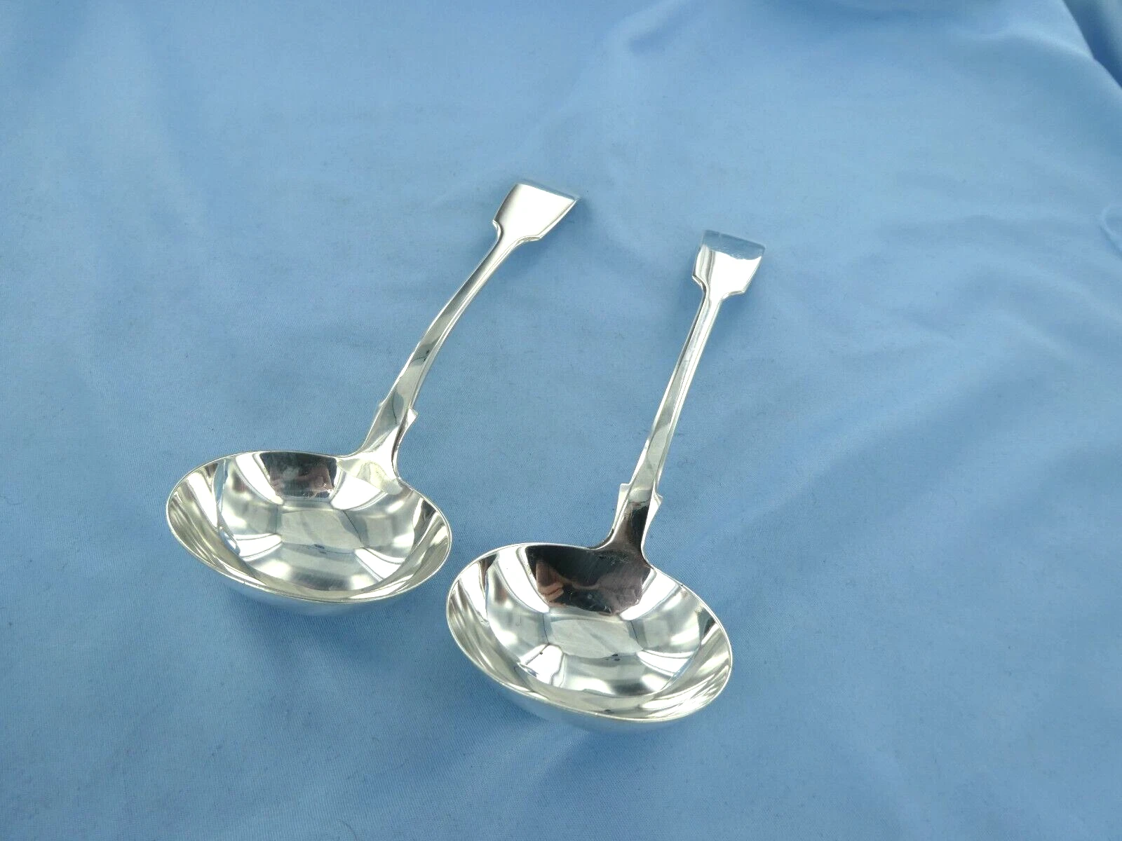 AN ANTIQUE PAIR OF STERLING SILVER FIDDLE BACK SAUCE LADLES. LONDON 1849.
Opens in a new window or t