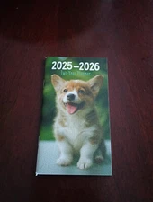Dog Puppies 2025  2026 Monthly 2 Year Pocket Planner 64 pages 3.3 x 6