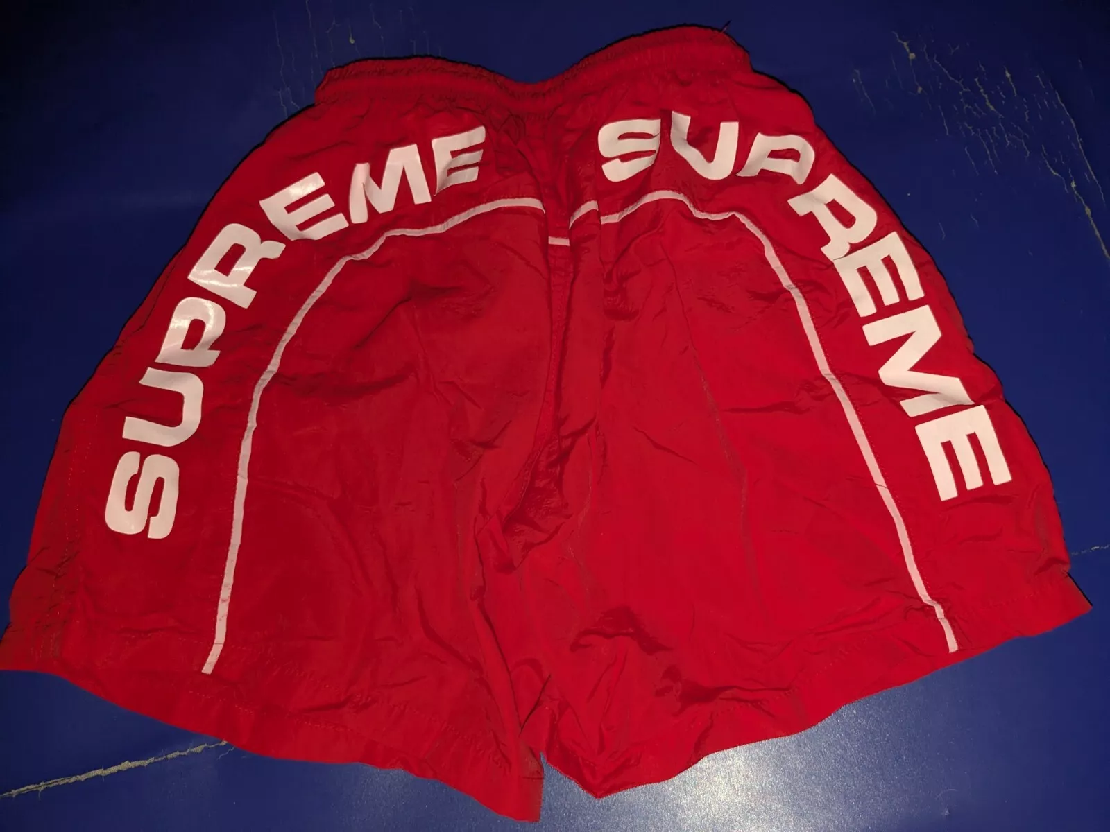 Short d'eau logo Supreme Arc   Maillot de bain rouge/grand
