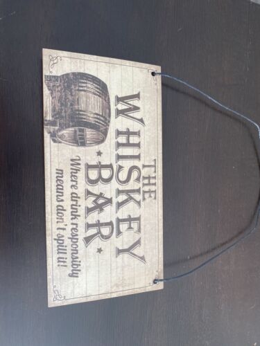 wooden sign (the whiskey bar)