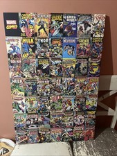 a large framed picture featuring a collage of classic Marvel comic book covers