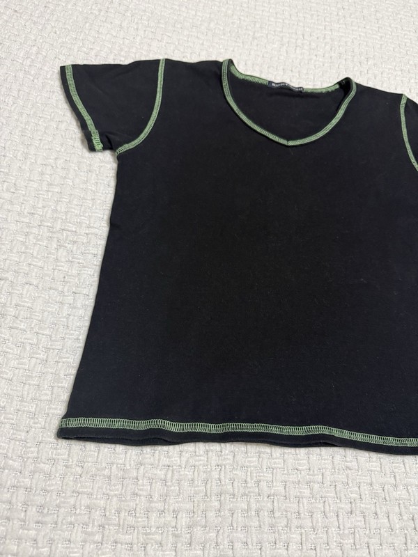 Brandy Melville women’s black baby tee with green hem.  Fits like a Large