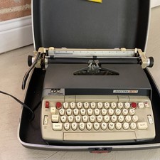 Smith-Corona Electra 120 typewriter w/case seems to work. thumbnail