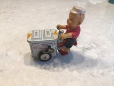 VINTAGE JAPAN WIND UP MOVING TIN ICE CREAM CART SCOOTER W CELLULOID BOY SELLER