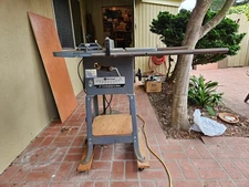 1950's Rockwell Contractor's Table Saw 9 inch on a steel stand with wheels.  