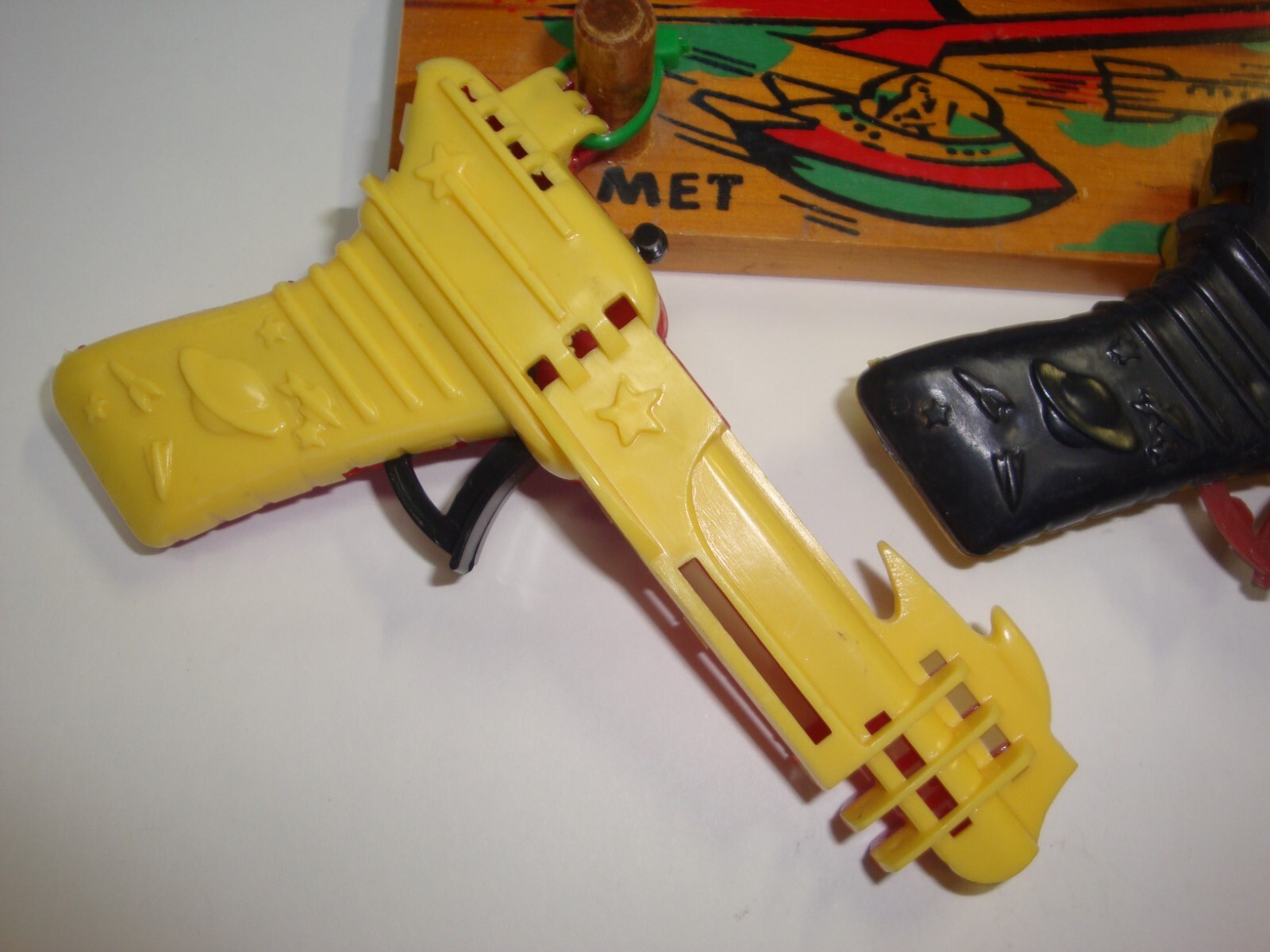 Vintage 50's Set of Three Atomic Space Ray Guns with Spaceman Hanger