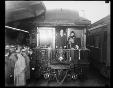 Photo:[Herbert Hoover and Lou Hoover on back of train]