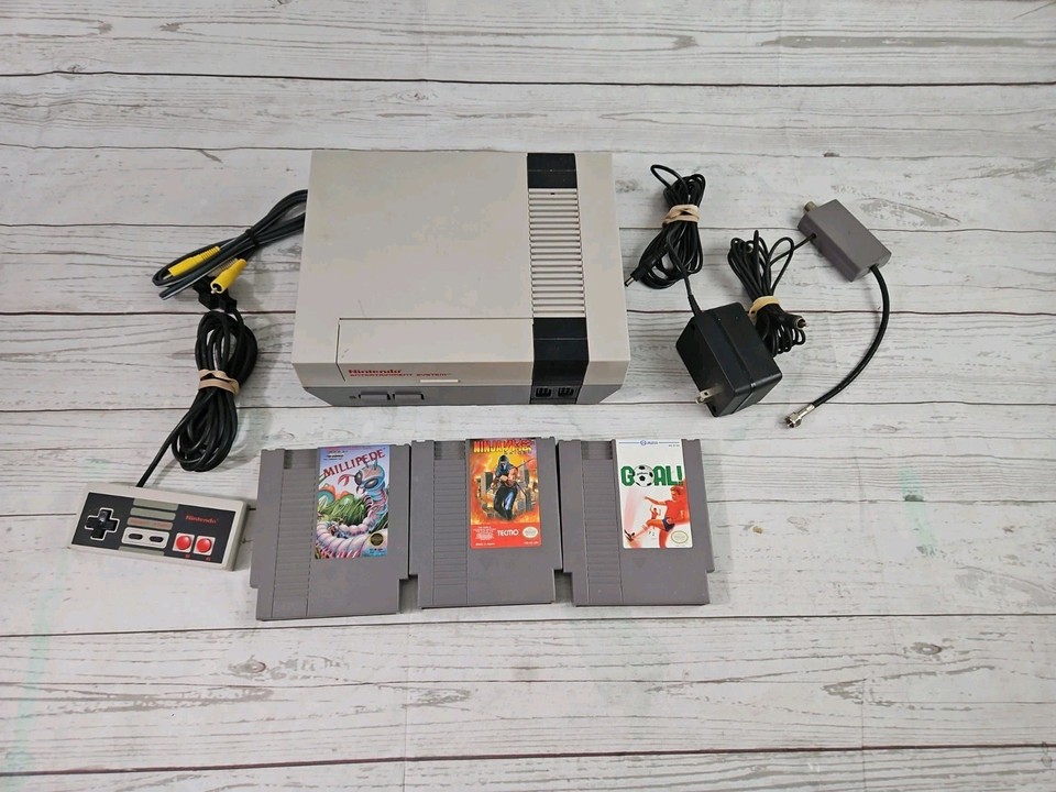 An original 1985 NES-001 launch console with 3 games — the grandfather of modern gaming in its original gray-brick glory.
