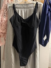 wear moi black ballet leotard with two straps in back like bows