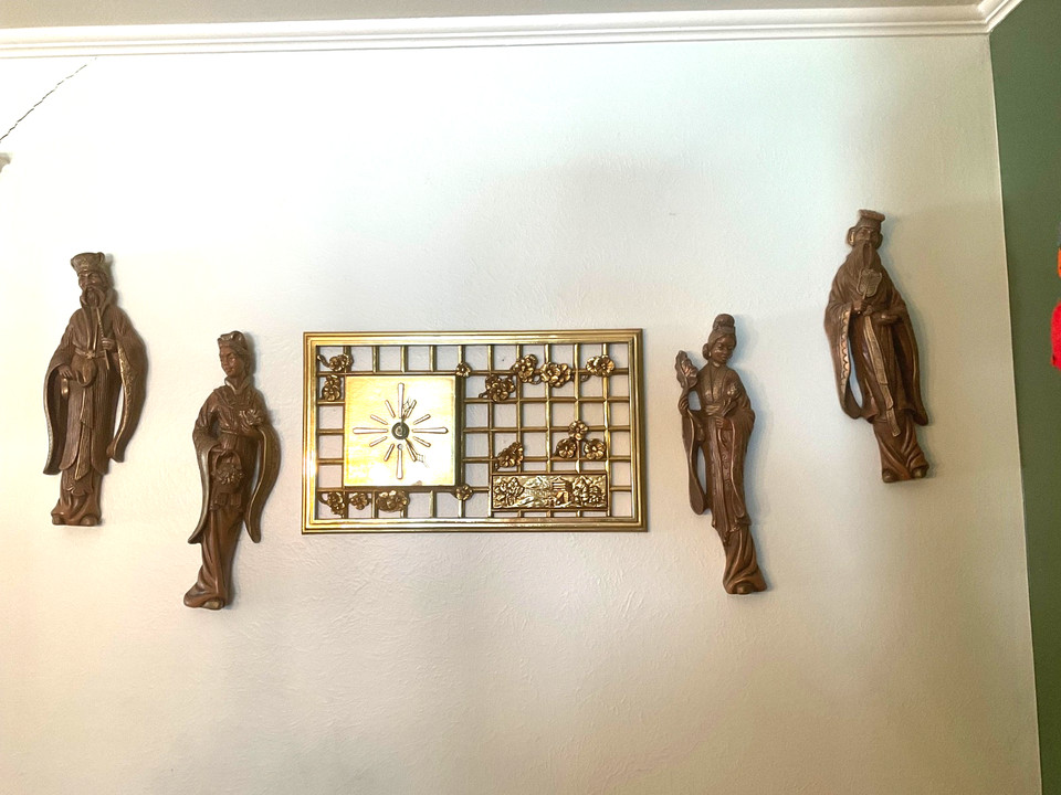 A set of vintage mid-century chalkware Asian wall art with a matching clock — a cohesive, unusual retro set that defines a whole era of American home décor.