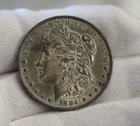 1884 O US Morgan Silver Dollar $1 AU (Cleaned, Retoned)