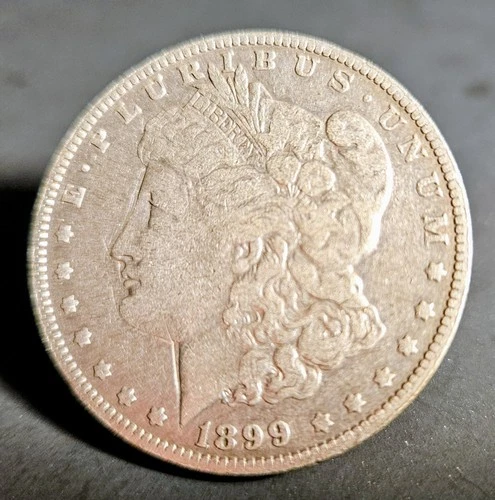 1899 P Morgan silver dollar VF - Valuable - low mintage 330,000